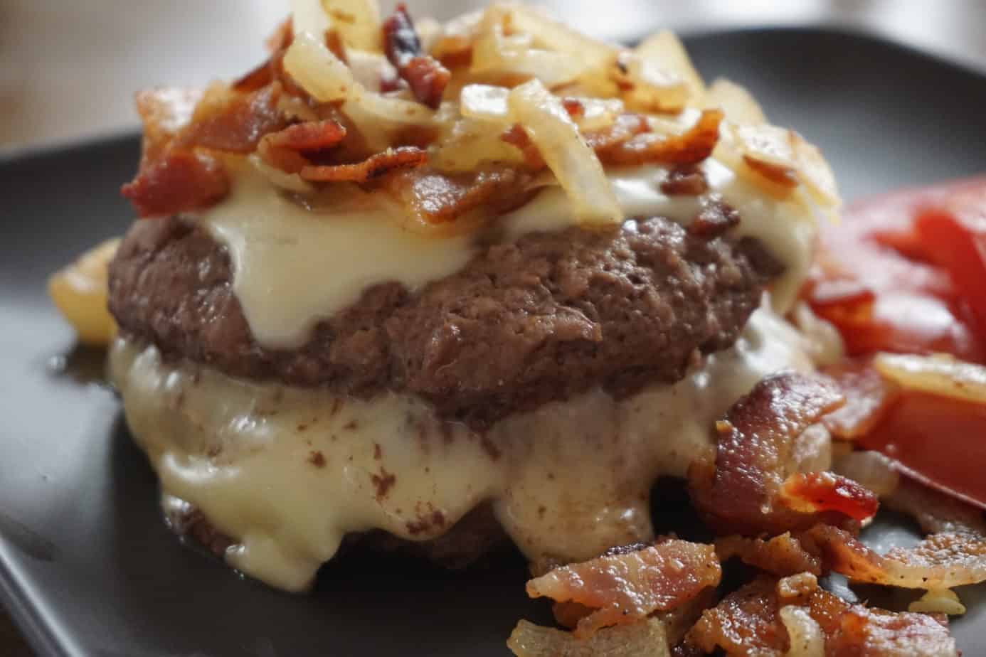 cheesy bourbon bacon burger with onions