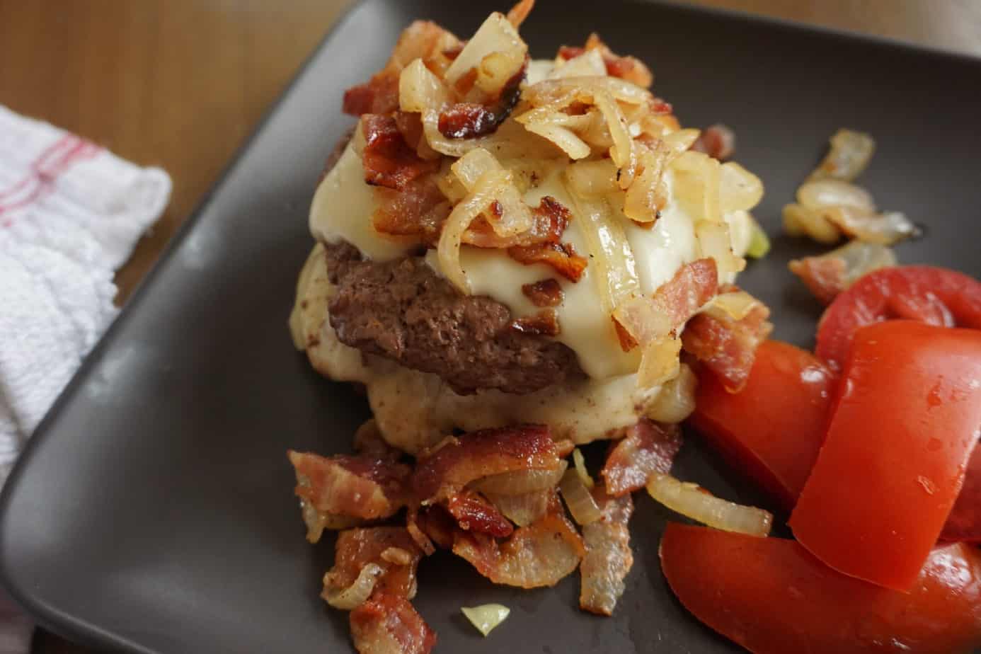 burger covered in cheese and bourbon bacon jam