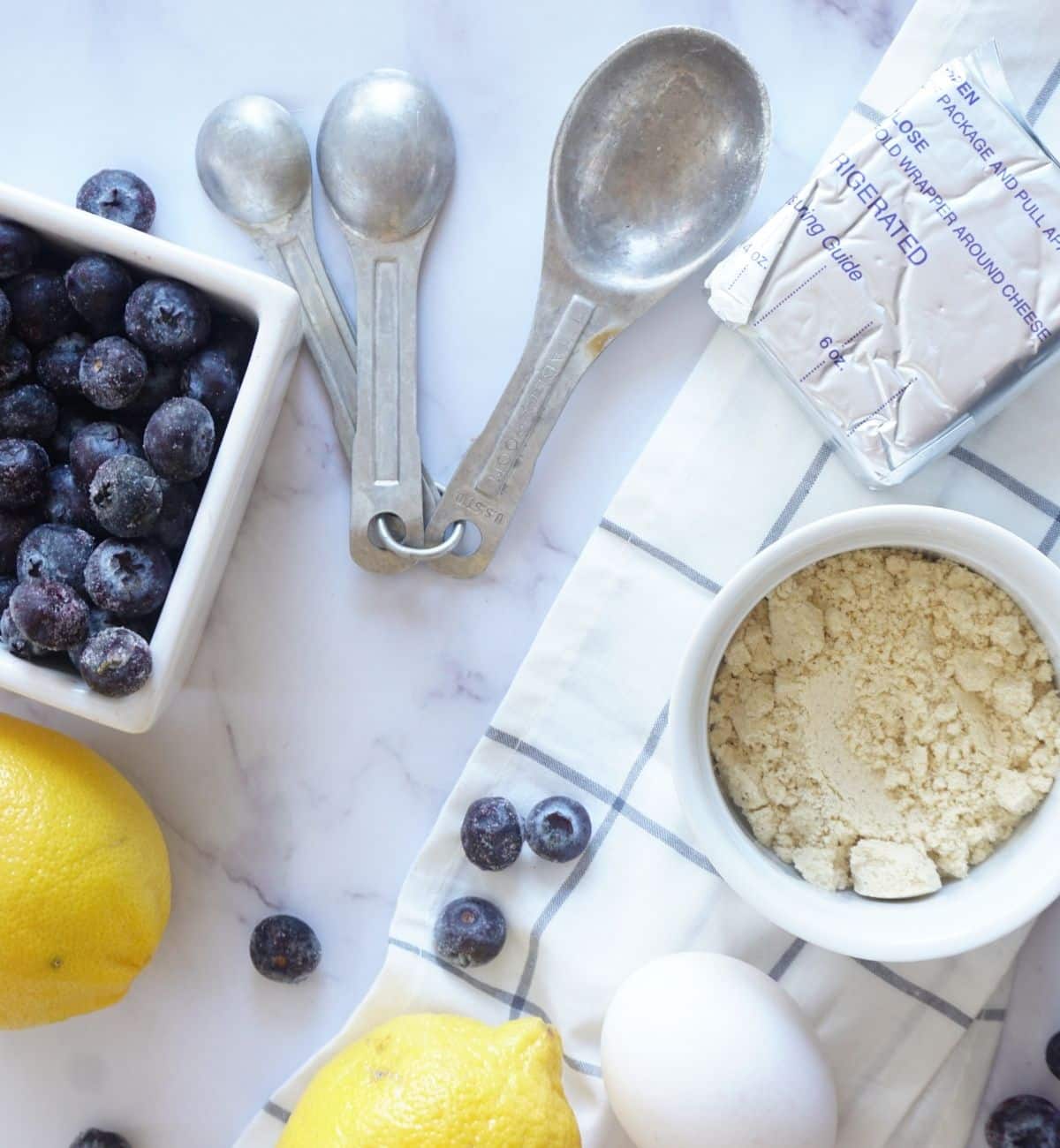 blueberry lemon waffle ingredients with measuring spoons