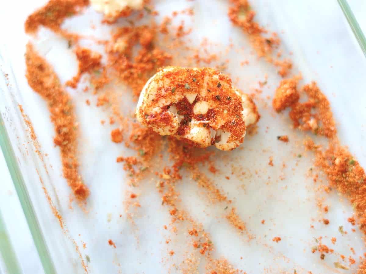 cauliflower floret dipped in pizza spice