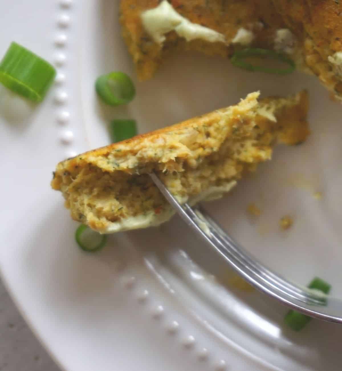 flakey salmon patties cut open with a fork