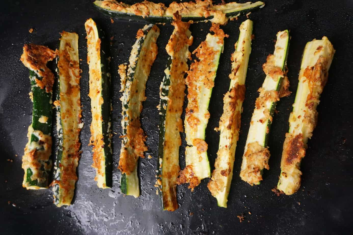 crisp zucchini fries on a baking sheet