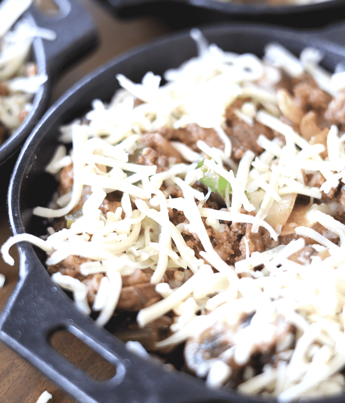 placing monterey cheese on top of casserole