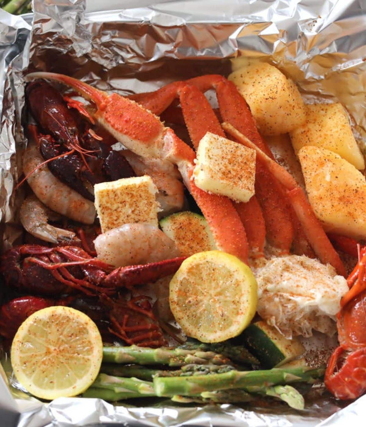 cajun lemon butter with crab legs and asparagus