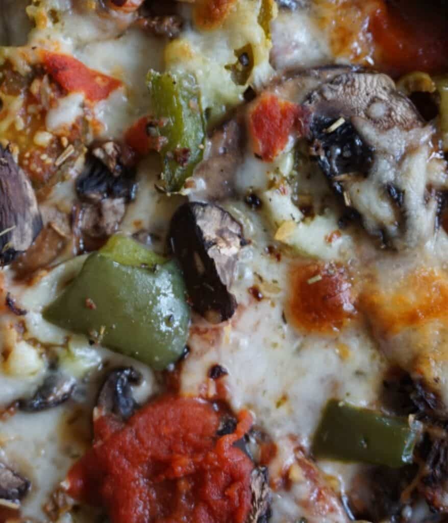 peppers cheese and mushrooms with melted mozzarella cheese