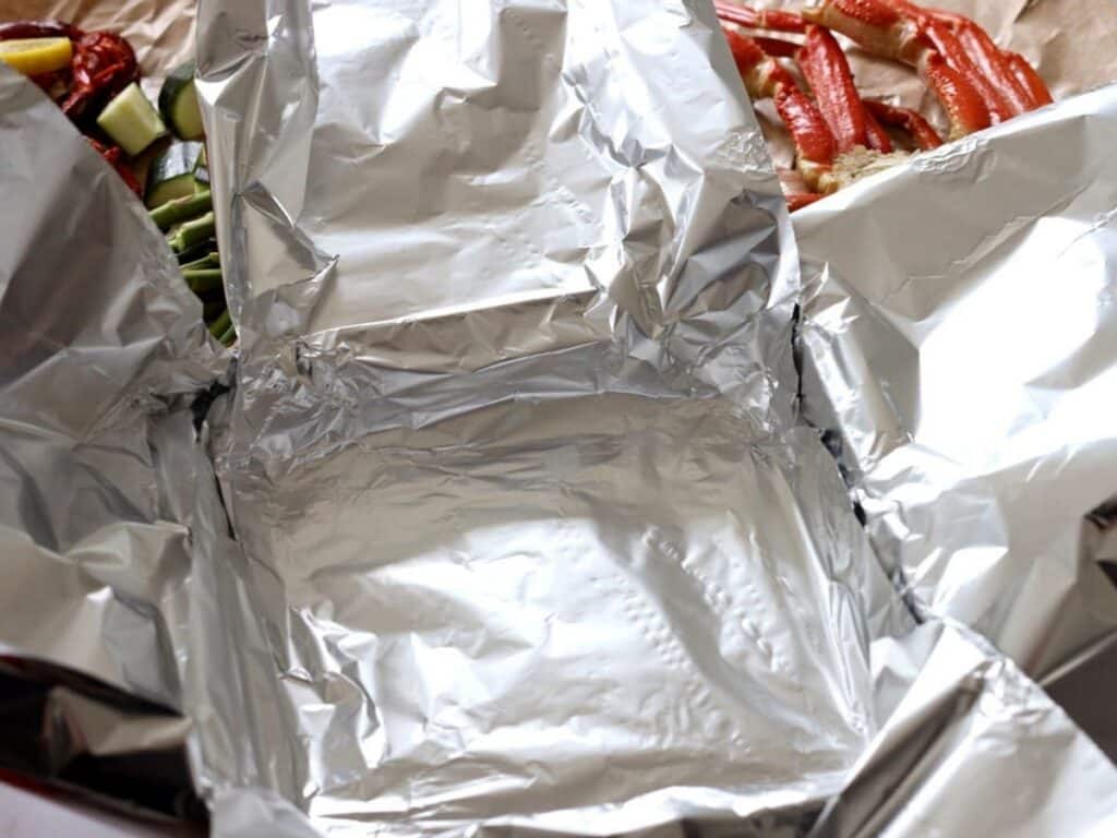 prepping foil for seafood bake