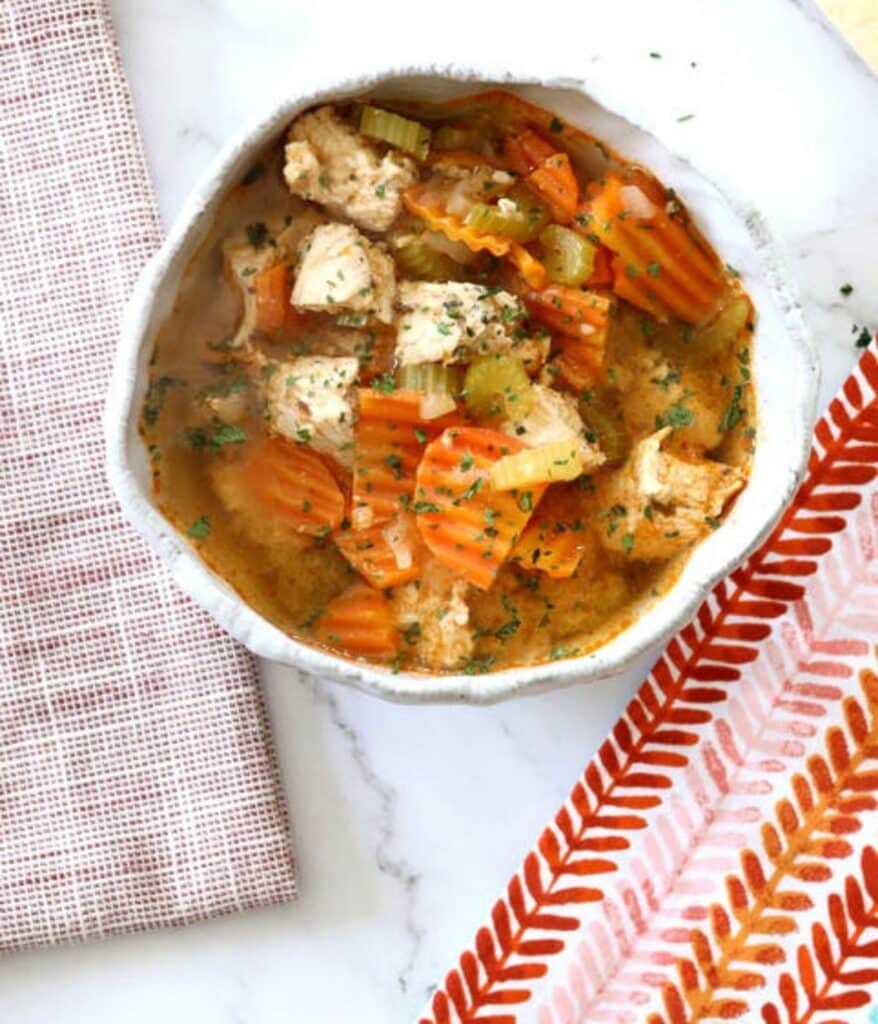 homestyle turkey soup with carrots in a bowl