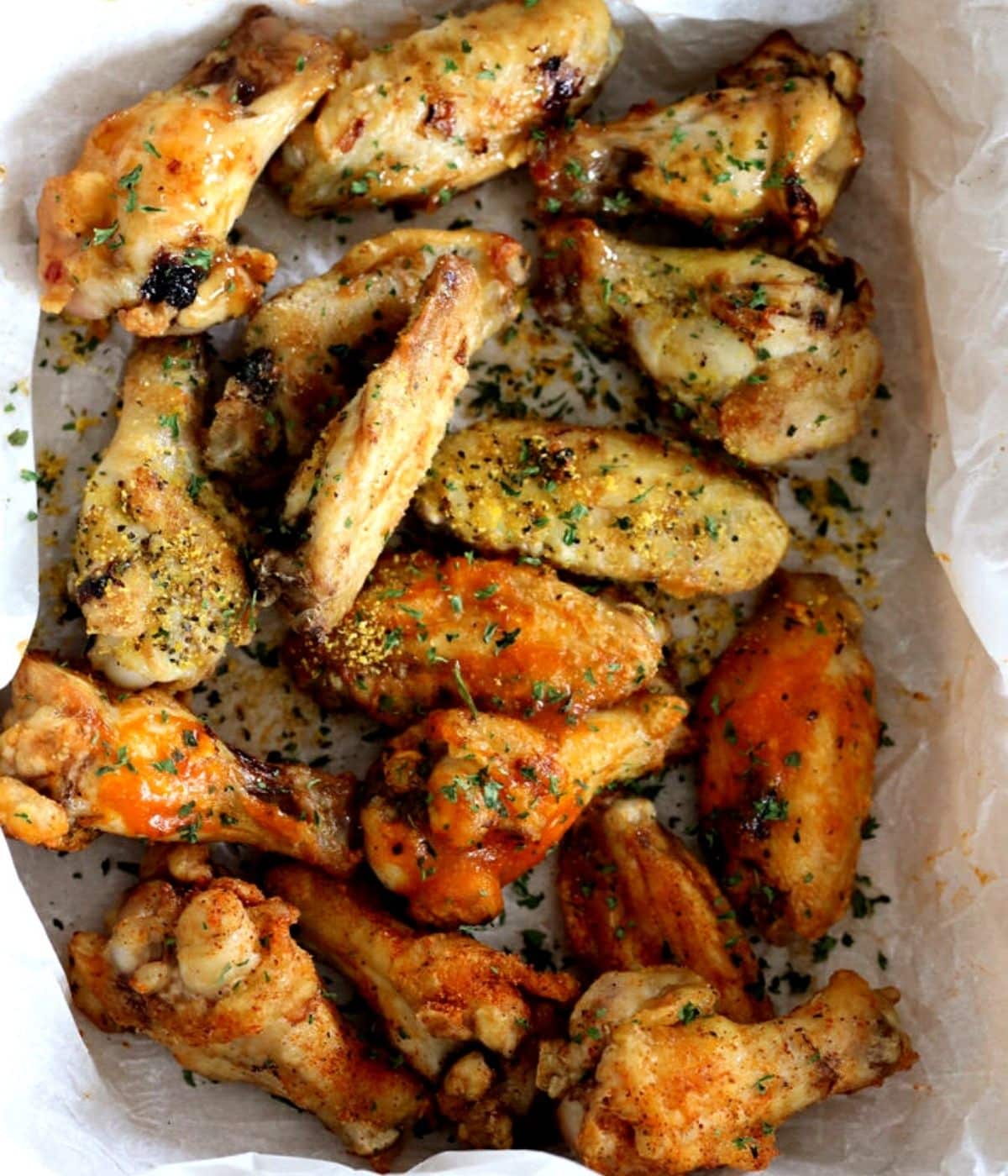 crisp air fryer wings with seasonings and parsley on top