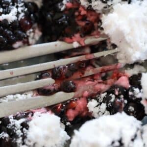 mashing berries with sweetener
