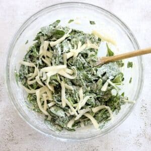 mixing cream cheese and spinach
