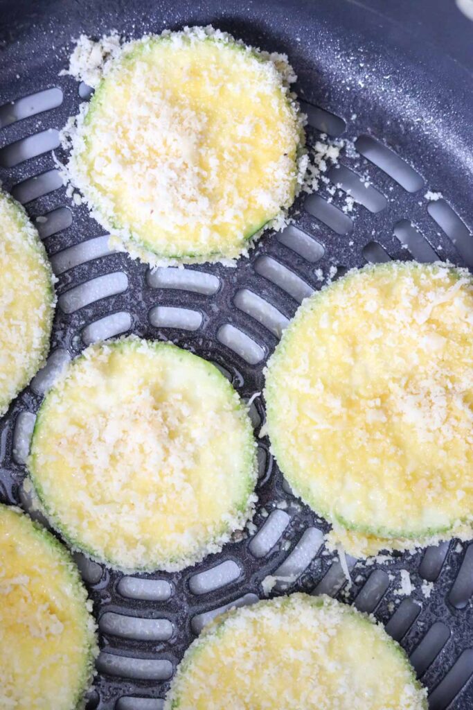 breaded low carb zucchini chips in air fryer basket