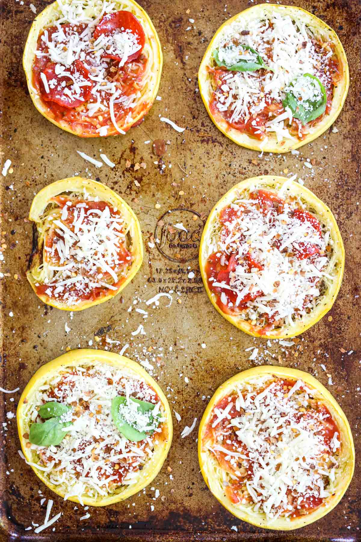 adding toppings to spaghetti squash pizza