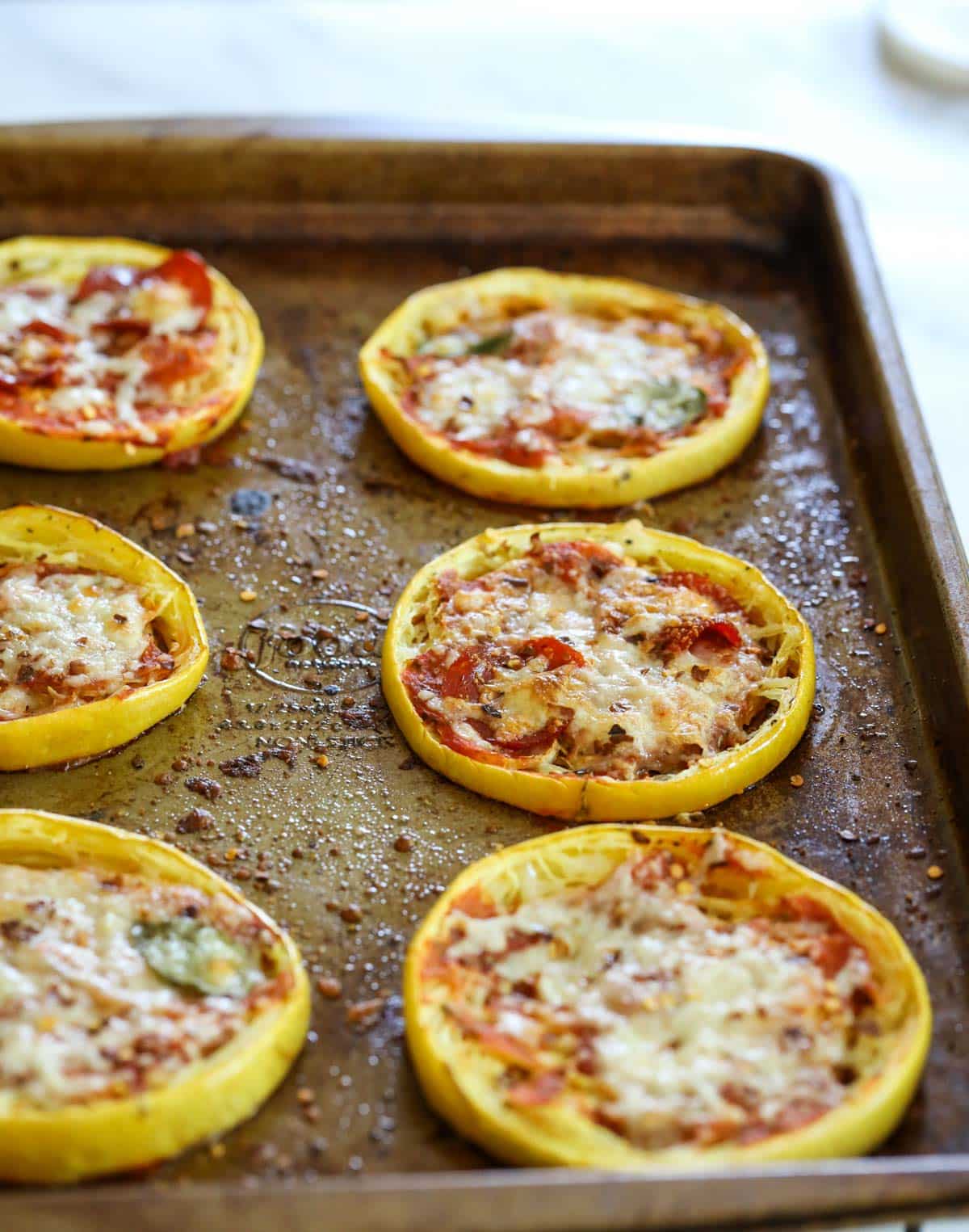 freshly baked squash pizza from the oven on a baking dish