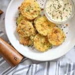 parmesan zucchini crisps with peppercorn grinder and dip