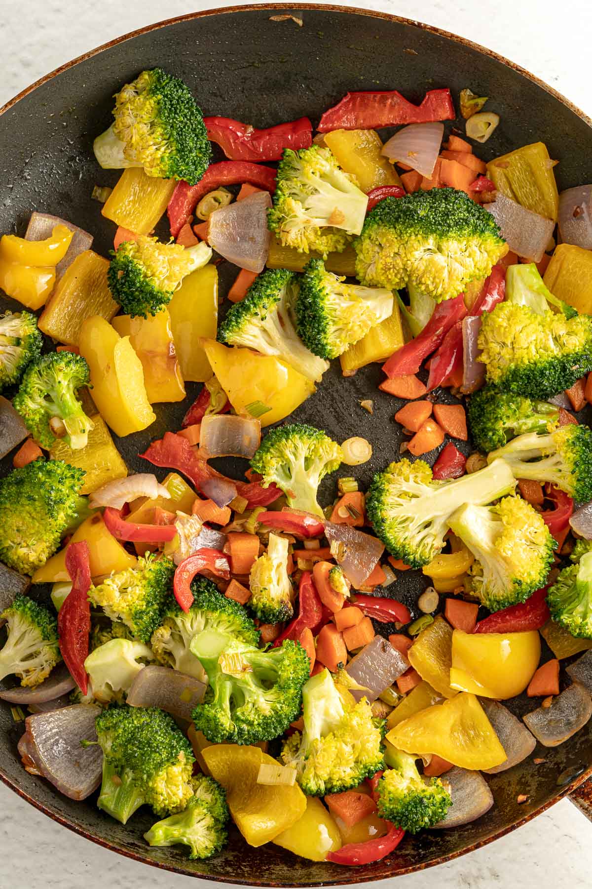 veggies and soy sauce in a pan