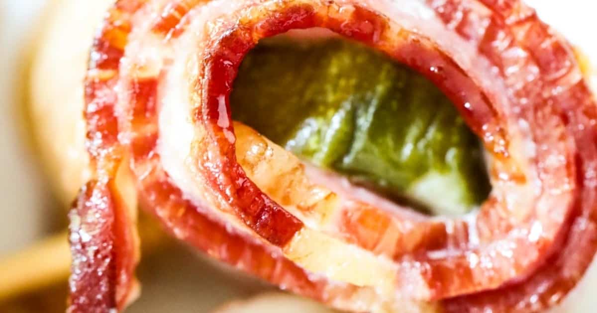slice of bacon wrapped around dill pickle