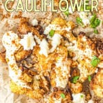 air fryer cauliflower on parchment paper with Mexican spices and cojita cheese