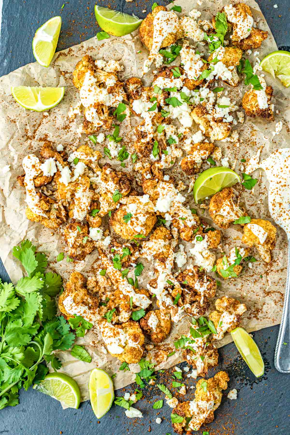 cauliflower with street style ingredients on parchment paper