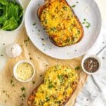 cheesy butternut squash with seasonings and fresh spinach