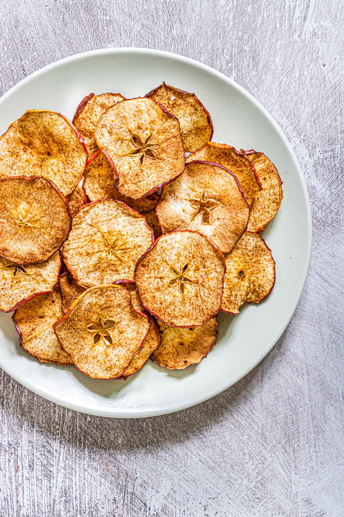 air fried apple chips on a plate