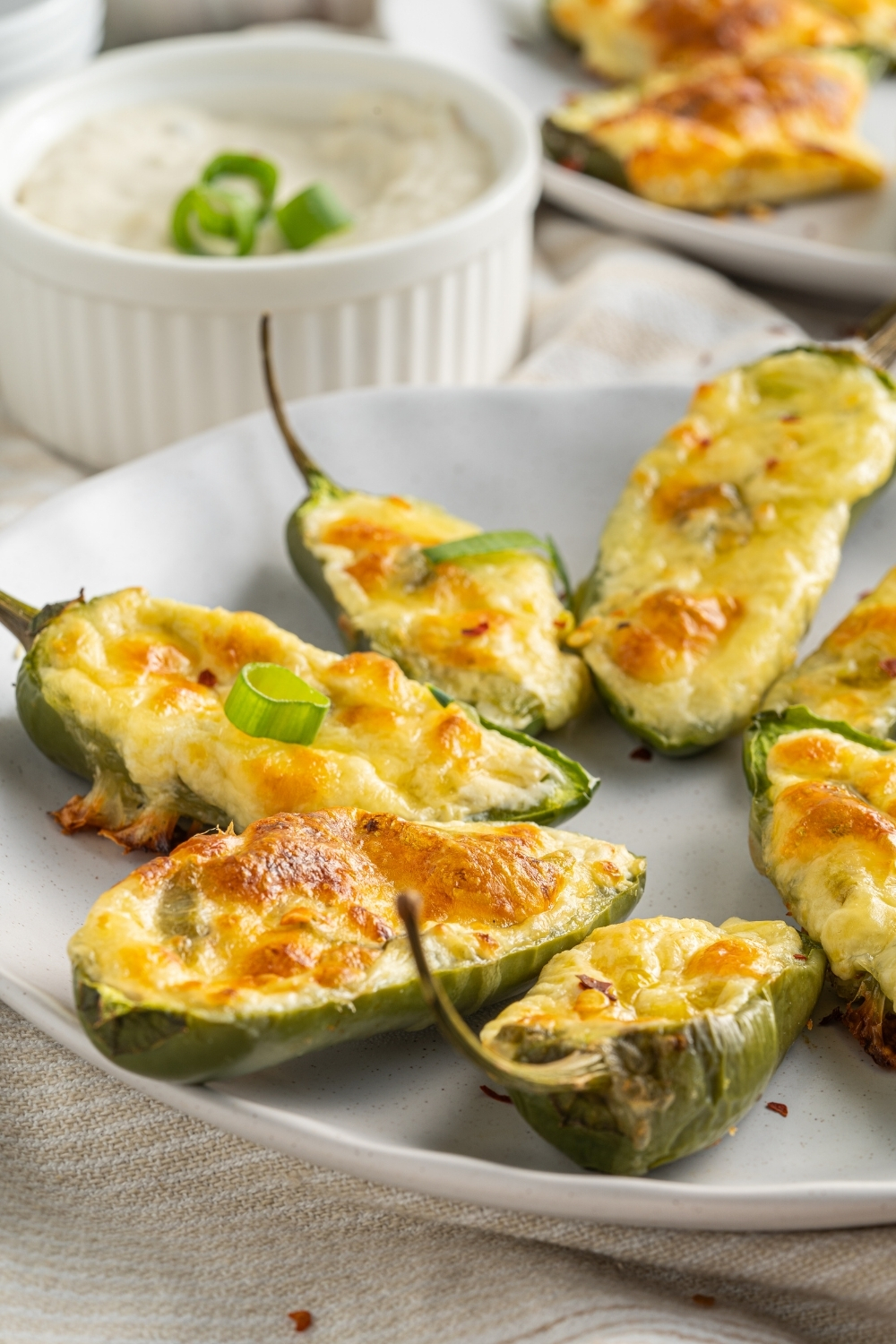 jalapeño poppers with golden crust on a plate