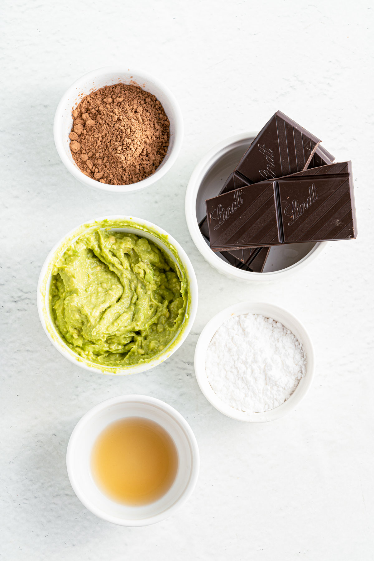 avocado truffle ingredients, including dark chocolate, cocoa powder, avocado mash, and erythritrol