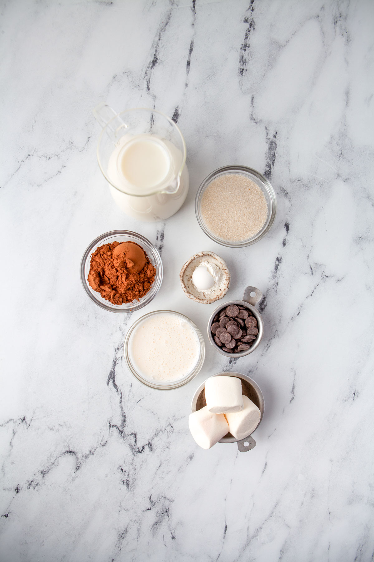 hot chocolate ingredients on a marble countertop