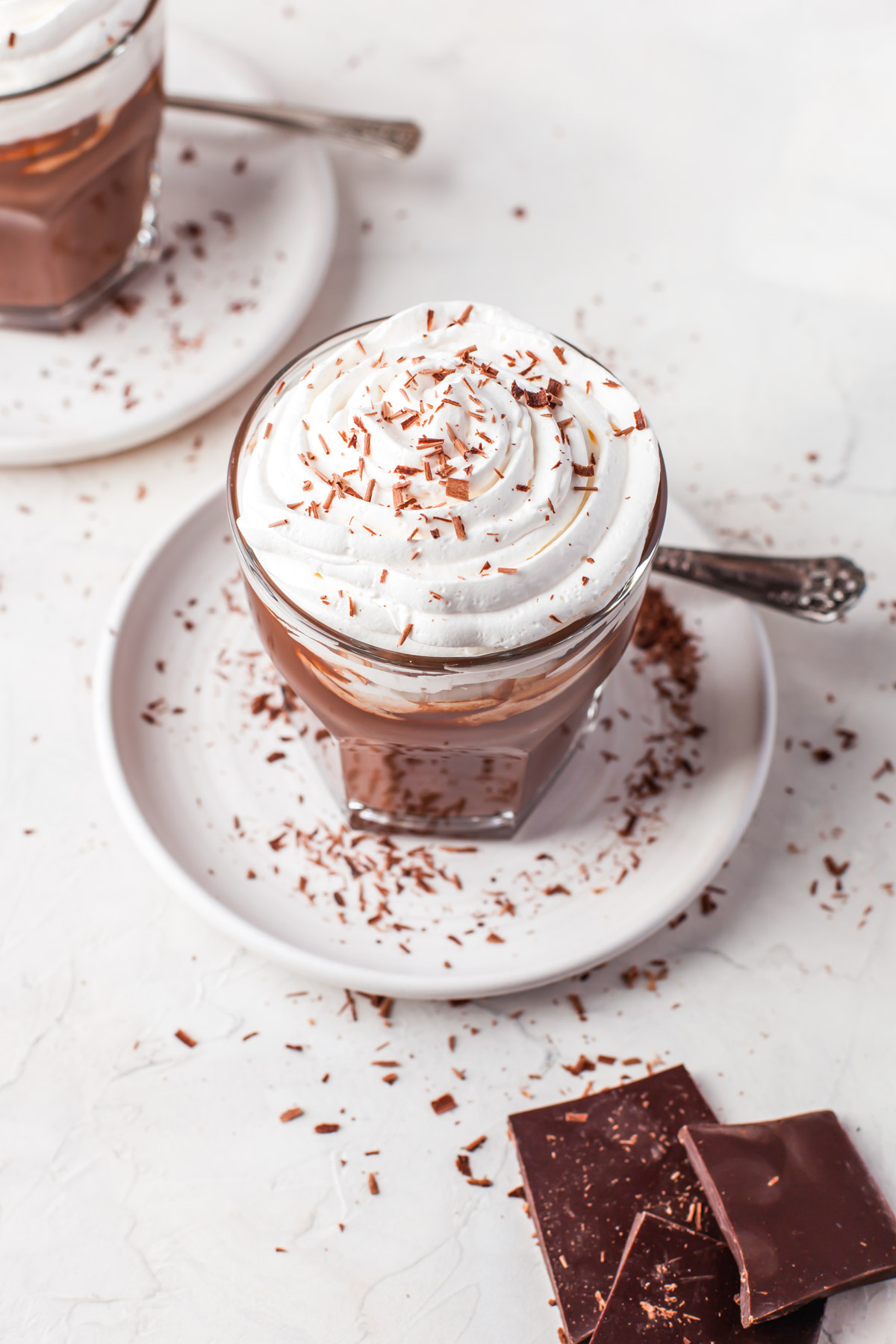 chocolate bar next to a thick rich cup of hot chocolate