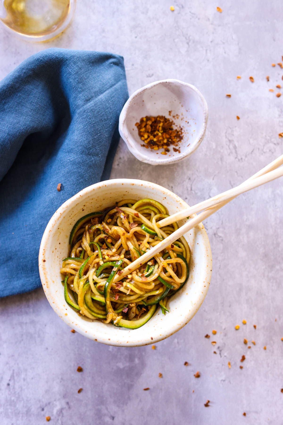 zoodles in a bowl with red pepper flakes