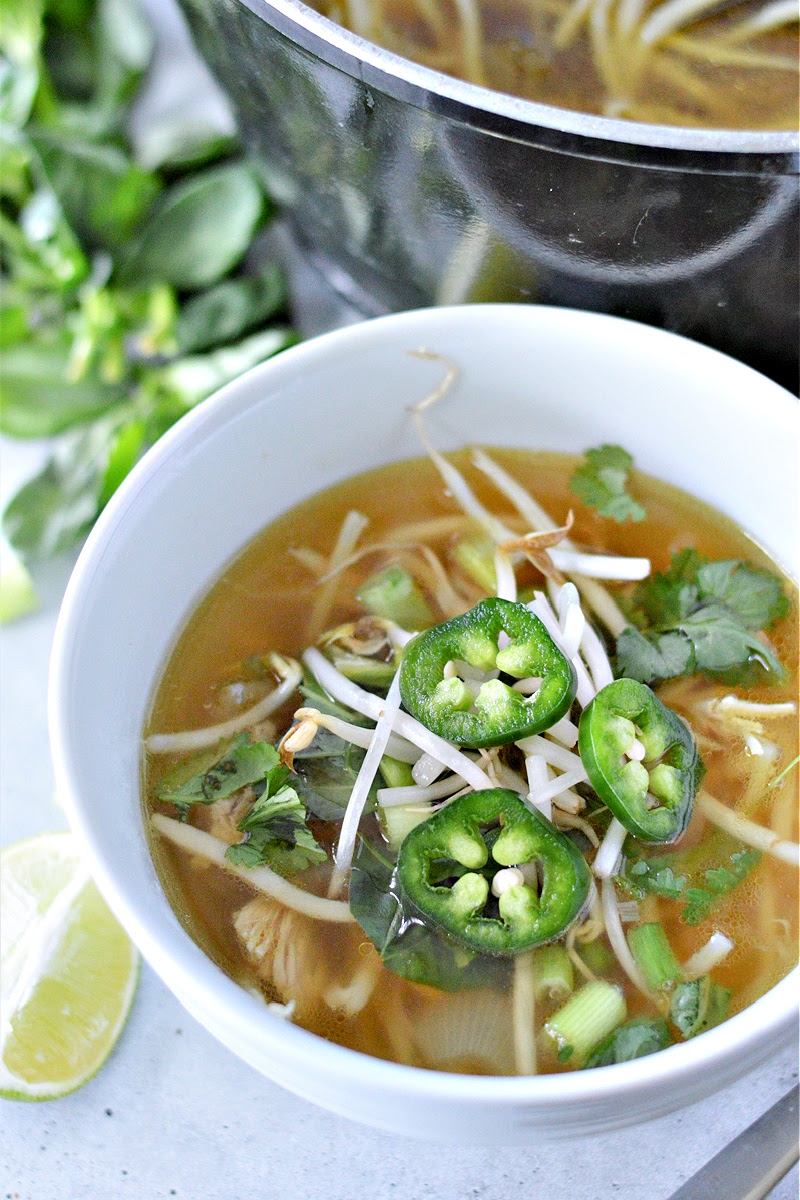 chicken pho soup topped with chipped jalapeño garnish