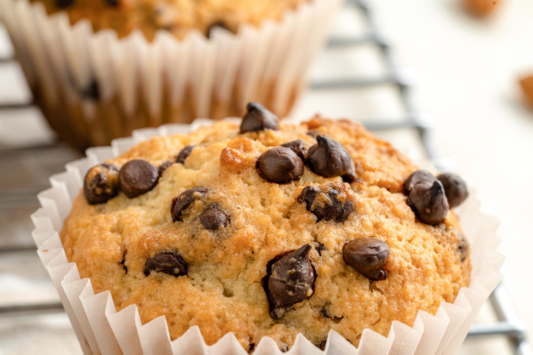 chocolate chip muffins on a cooling rack