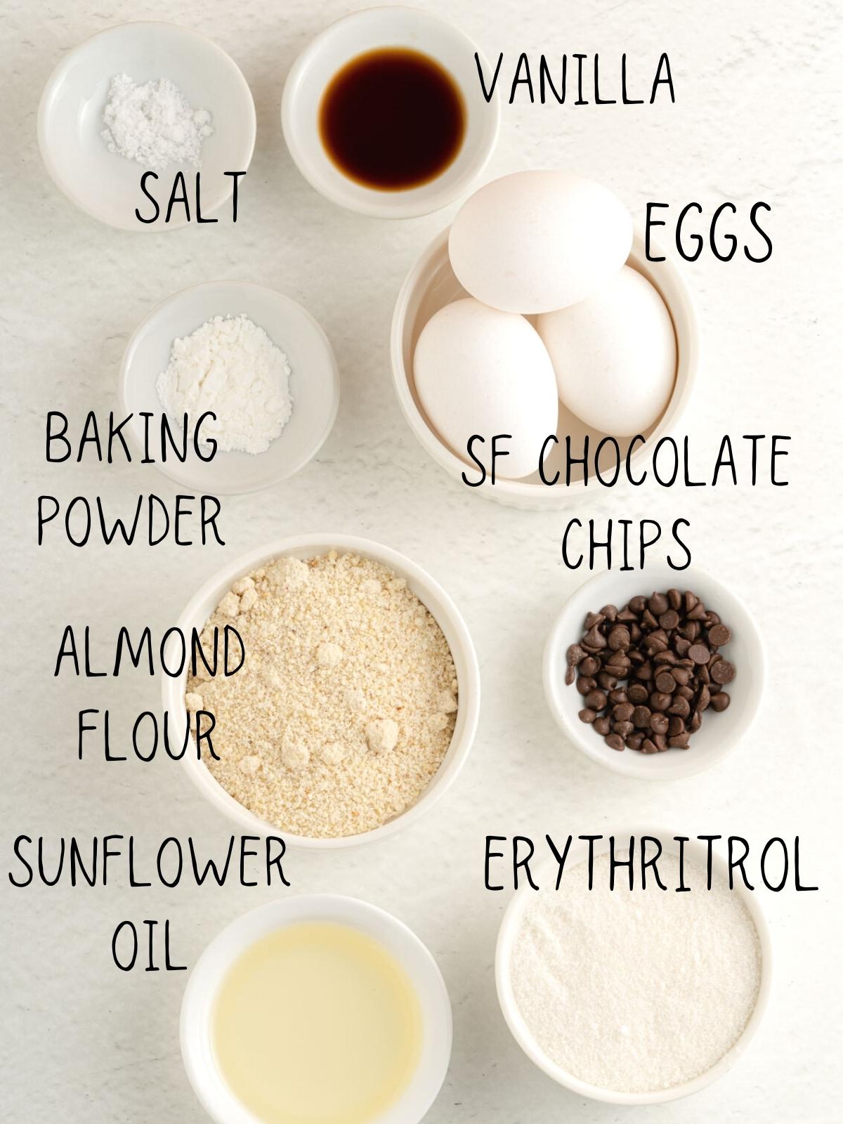 ingredients for almond flour chocolate chip sugar free muffins, including sugar free chocolate chips, vanilla, sweetener
