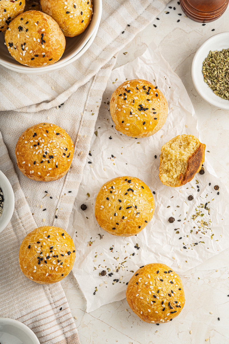 dinner rolls on a pink and white napkin