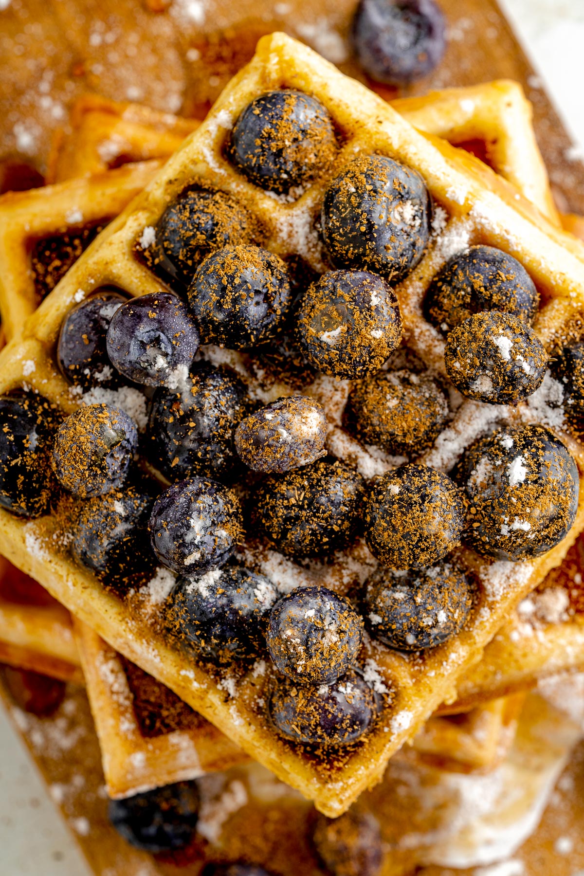 view from above waffles, showing blueberries and cinnamon on top